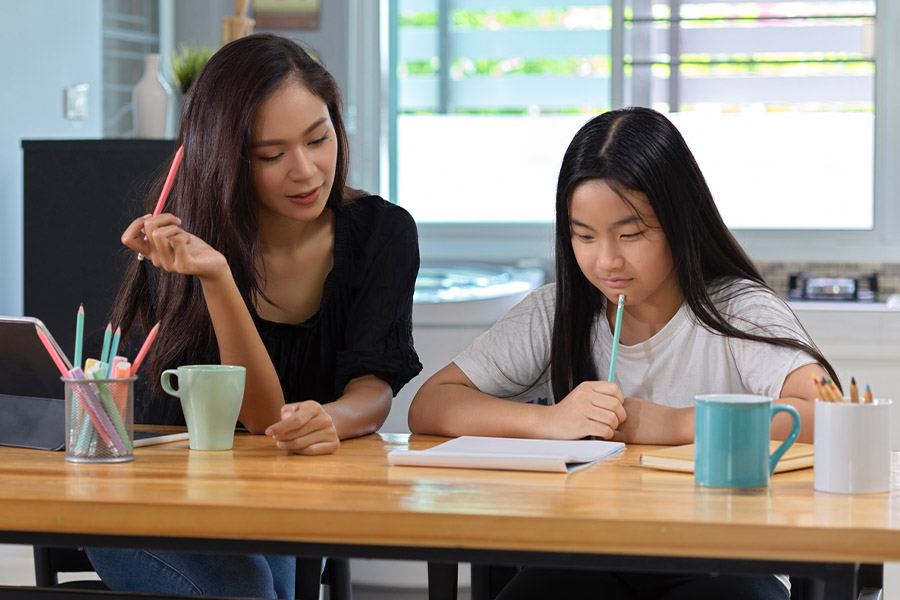 student and tutor together at a desk in Ann Arbor